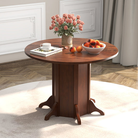 Round Dining Table With Pedestal Base, Walnut, For 4-6 People Dining Tables Walnut at Gallery Canada