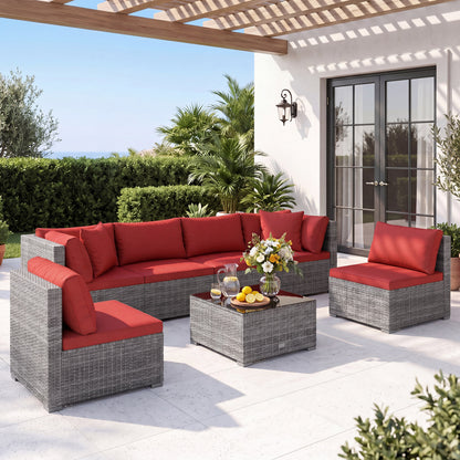 Ensemble de patio en rotin de PE de 7 pièces, table en verre, coussins, rouge