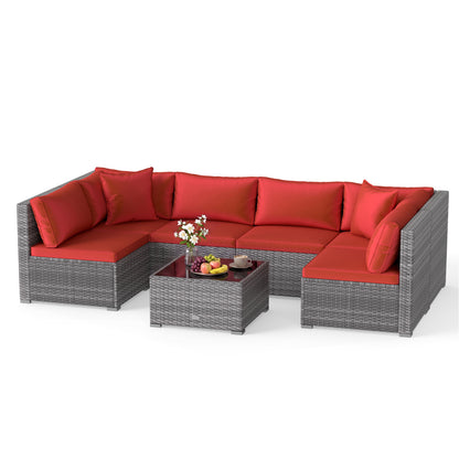 Ensemble de patio en rotin de PE de 7 pièces, table en verre, coussins, rouge