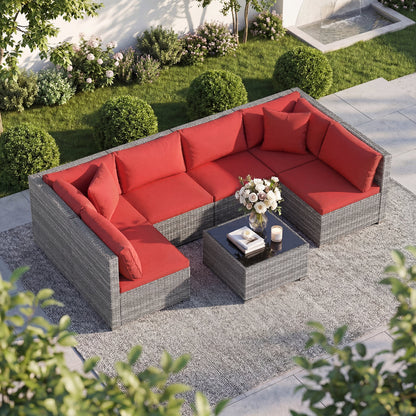 Ensemble de patio en rotin de PE de 7 pièces, table en verre, coussins, rouge